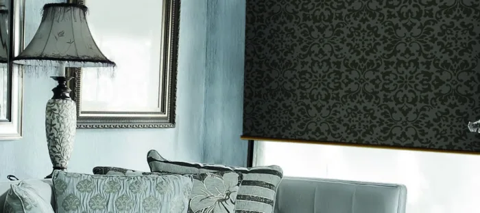 Elegant vintage living room with damask patterns and lamp.