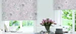 Floral blinds in stylish interior with scenic view.