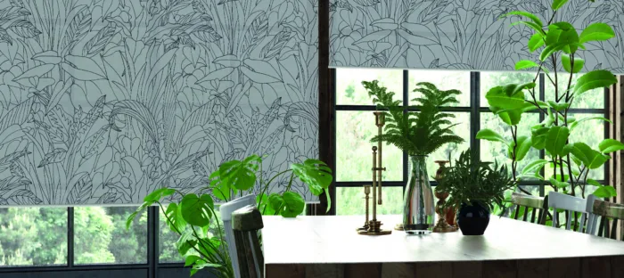 Modern room with botanical wallpaper and lush indoor plants.