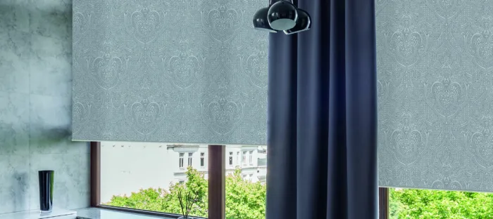 Elegant grey patterned blinds in modern room.