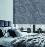 Elegant bedroom with botanical wallpaper and plush grey bedding.
