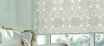 Elegant damask pattern roller blind in luxurious room.