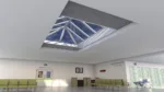 Modern hospital waiting area with skylight and seating.