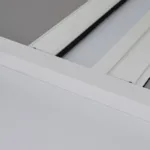 Close-up of white window frame and sill.
