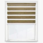 Zebra blind on white window frame, wooden texture.