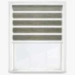 Modern zebra roller blind on window, adjustable light control.