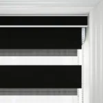 Close-up of black and white striped window blind.