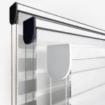 Modern blinds with chain controls on white background.