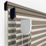 Striped roller blinds with control chains and mount detail.