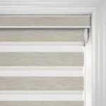 Beige fabric window blinds in a modern room
