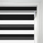 Black and white striped window blind, close-up.