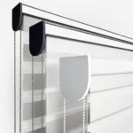 Blinds with control chains on white background.