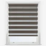 Brown and white zebra blinds in white window frame.