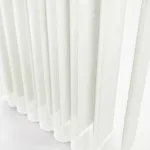 Close-up of white textured vertical blinds.