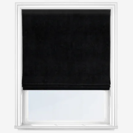 Black roller blind on white window frame.