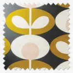 Geometric pattern fabric swatch in black, white, and gold.