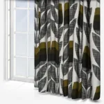 Modern patterned curtains by sunny window.