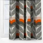 Patterned curtains in grey, white, and orange.