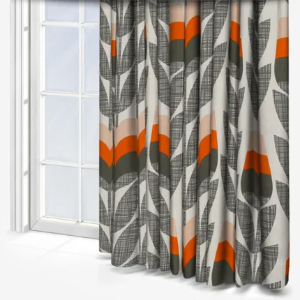 Modern patterned curtains by sunlit window.