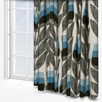 Stylish patterned curtains in room with bright window.