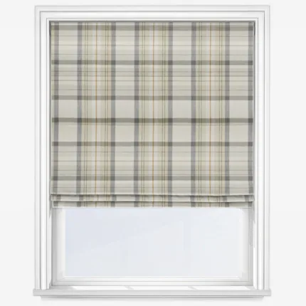 Tartan pattern roller blind on white window frame.