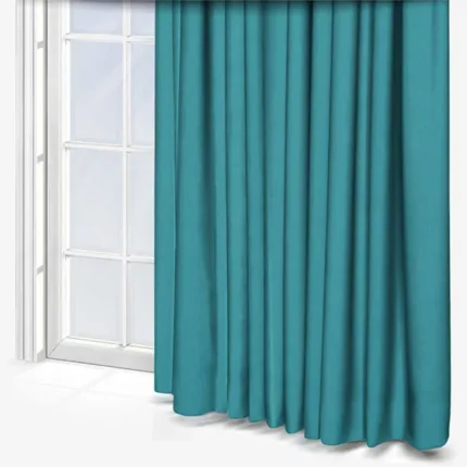 Teal curtains beside a white-framed window.