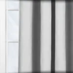 Sunlight filtering through vertical window blinds