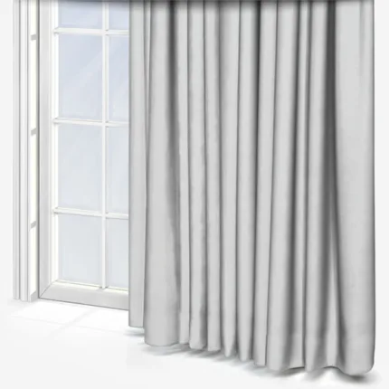 White curtains framing a bright window.