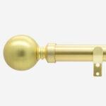 Gold-coloured curtain pole with spherical finial.