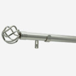 Modern grey curtain rod with ornamental finial isolated on white.