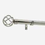 Metal curtain pole with decorative finial, wall-mounted.
