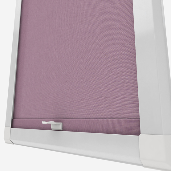 Purple roller blind in white window frame