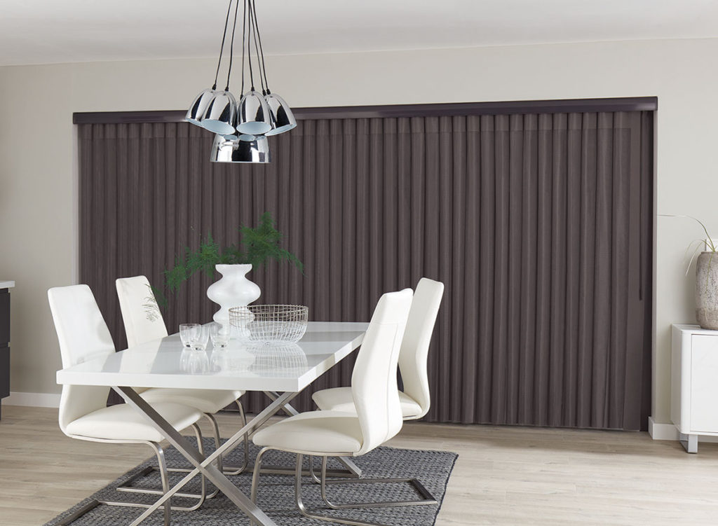 Modern dining room with stylish table and vertical blinds